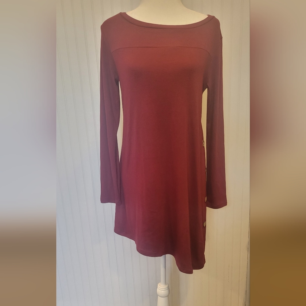 Korsis long sleeved dress size medium with an asymmetrical hem with buttons